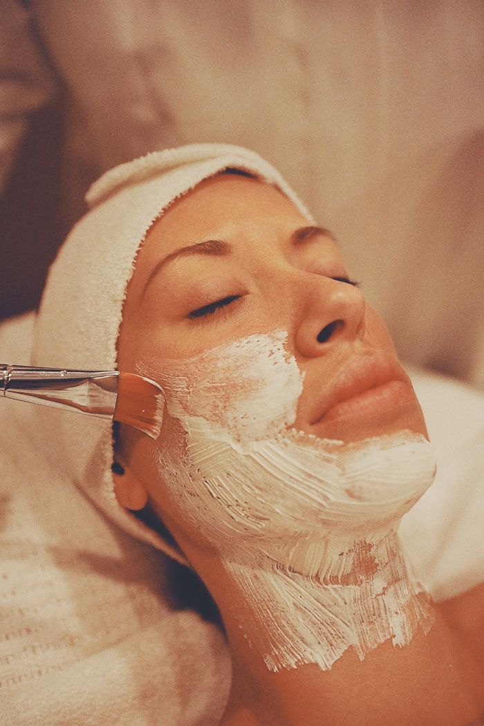 The Art of Drawing Readers In: Your attractive post title goes here A woman enjoys a soothing facial mask application during a relaxing spa session.
