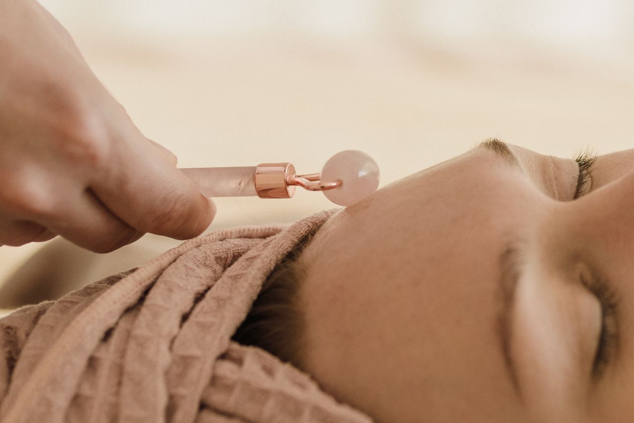 Crafting Captivating Headlines: Your awesome post title goes here Close-up of a jade roller massage during a facial spa treatment, promoting relaxation and skincare.